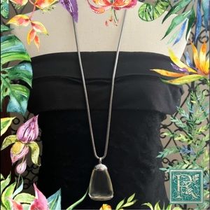 Chico’s chunky silver tone and champagne color lucite pendent